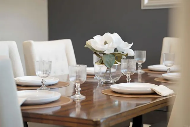 a dining room with furniture and wooden floor