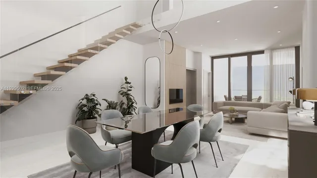 a living room with furniture or chandelier and a potted plant