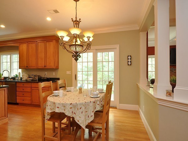 81 Montvale Road Weston, MA 02493 - Photo 15 of 27 a dining room filled chandelier and wooden floor