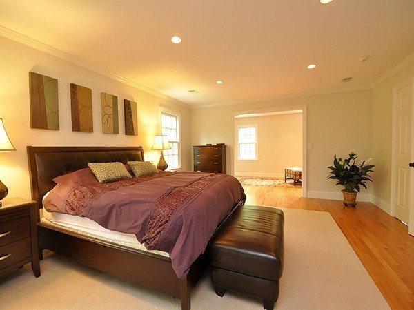 81 Montvale Road Weston, MA 02493 - Photo 19 of 27 a spacious bedroom with a large bed and a couch