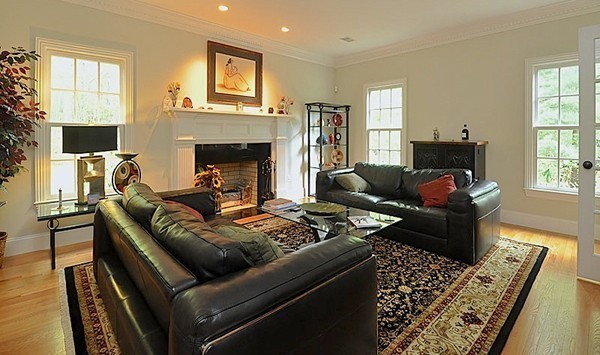 81 Montvale Road Weston, MA 02493 - Photo 3 of 27 a living room with furniture and a fireplace