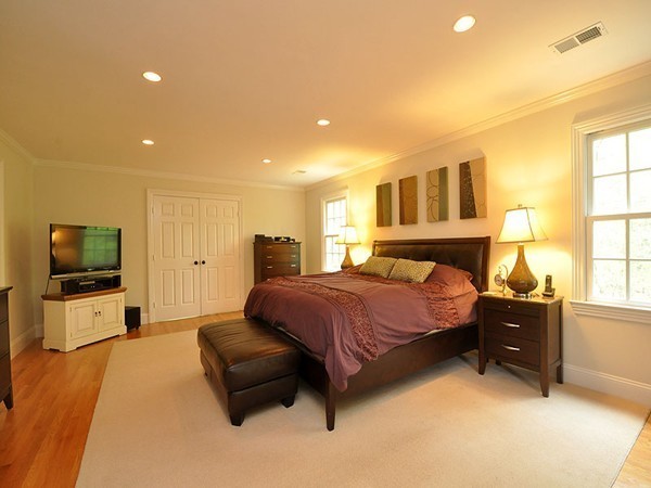 81 Montvale Road Weston, MA 02493 - Photo 7 of 27 a bedroom with a bed and flat screen tv
