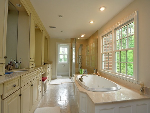 81 Montvale Road Weston, MA 02493 - Photo 8 of 27 a bathroom with a granite countertop tub sink and mirror
