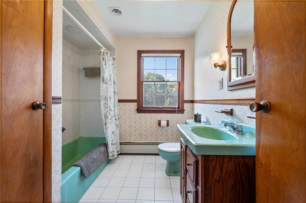 1178 Freeport Road Kittanning, PA 16201 - Photo 16 of 25 a bathroom with a sink a toilet and mirror