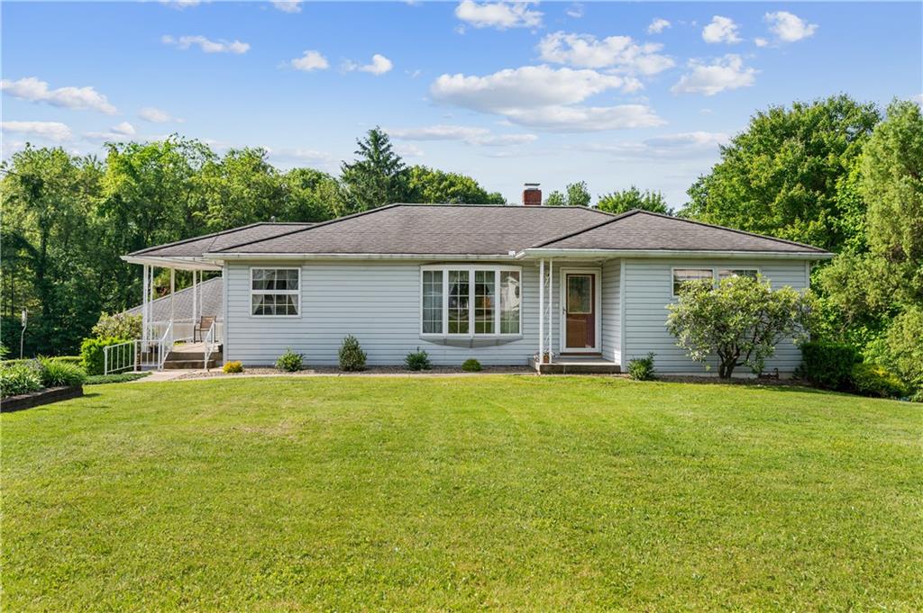 1178 Freeport Road Kittanning, PA 16201 - Photo 2 of 25 a front view of a house with a garden