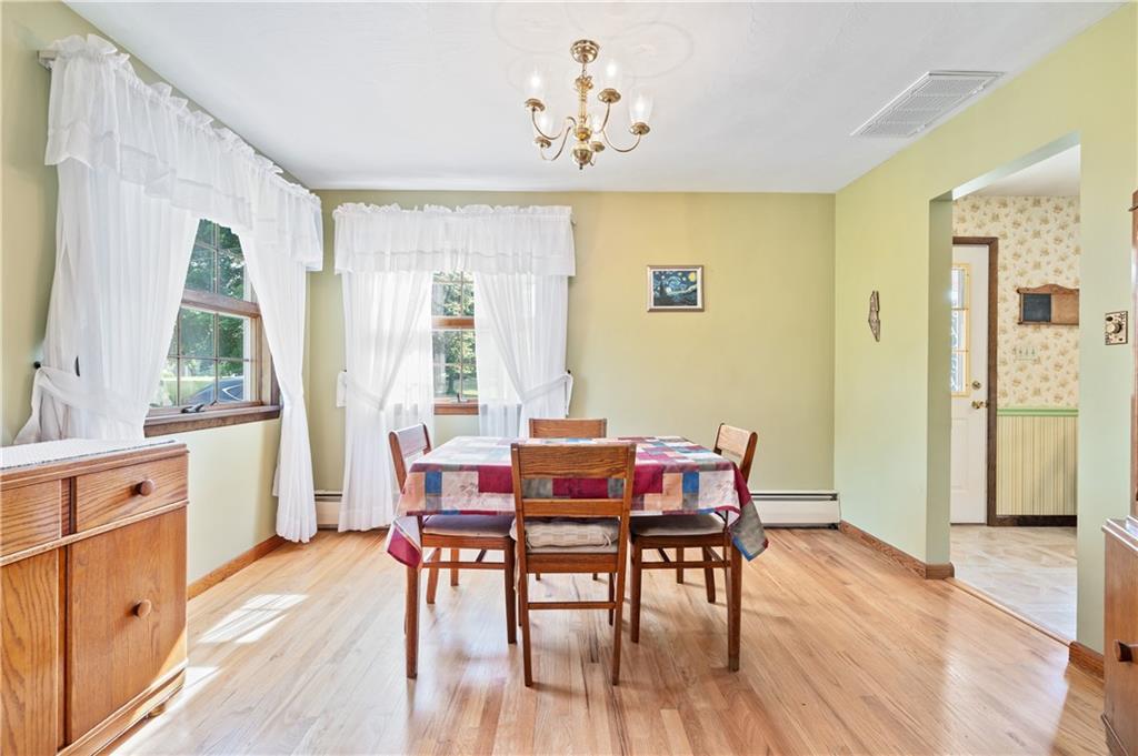 1178 Freeport Road Kittanning, PA 16201 - Photo 7 of 25 a view of a dining room with furniture window and wooden floor