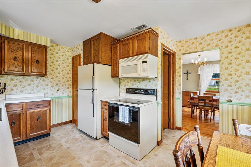 1178 Freeport Road Kittanning, PA 16201 - Photo 10 of 25 a kitchen with stainless steel appliances a stove a refrigerator and a stove top oven