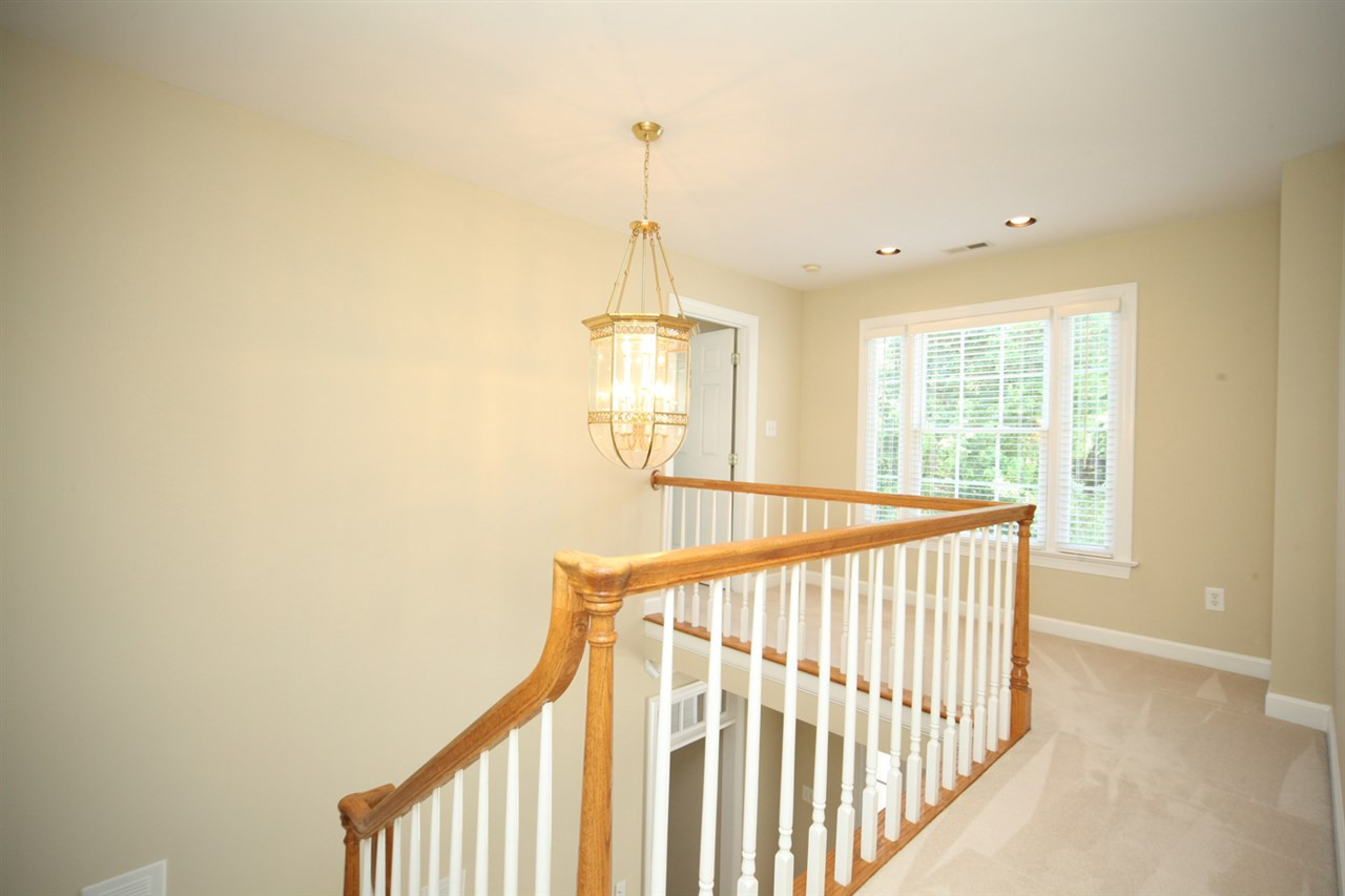 7712 Wilderness Road Raleigh, NC 27613 - Photo 13 of 25 Second Floor Walkway