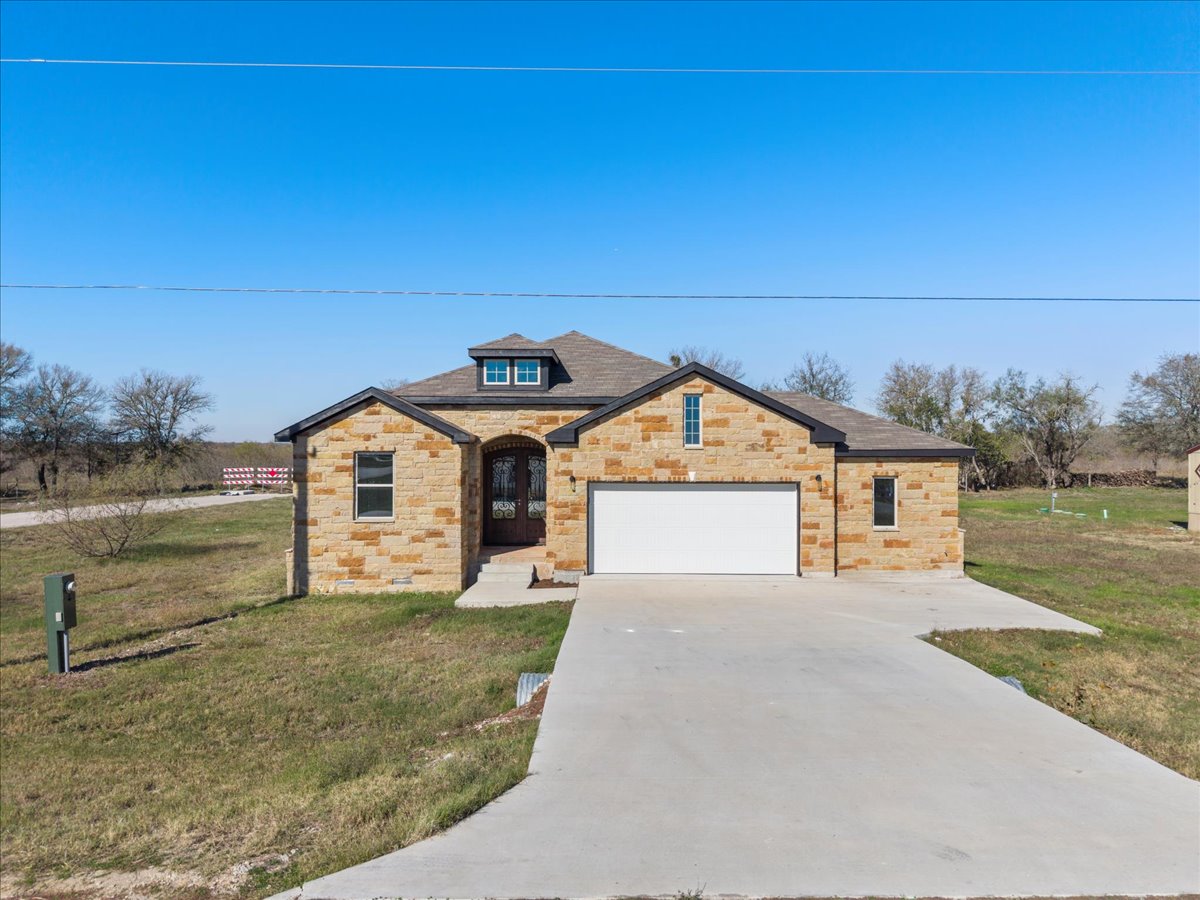 217 Gato Road Cedar Creek, TX 78612 - Photo 2 of 40 a view of a house with a yard