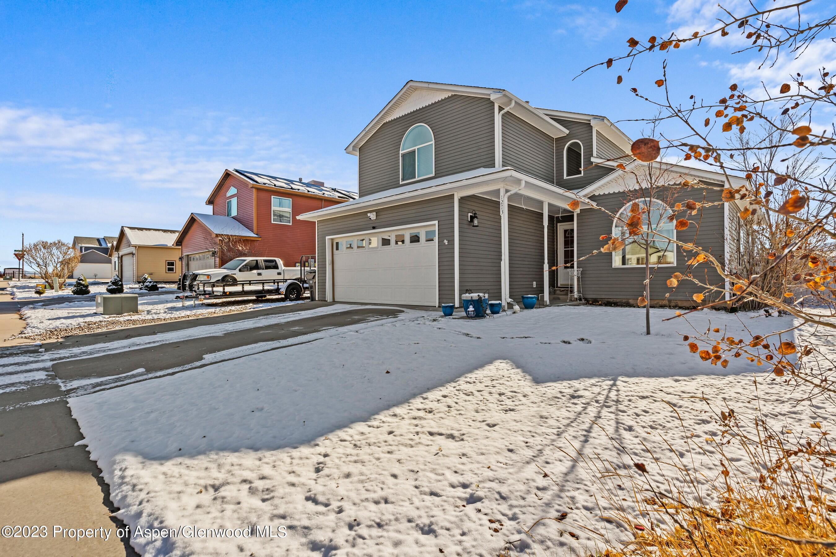 1273 East 18th Way Rifle, CO 81650 - Photo 1 of 26 a front view of a house with a yard