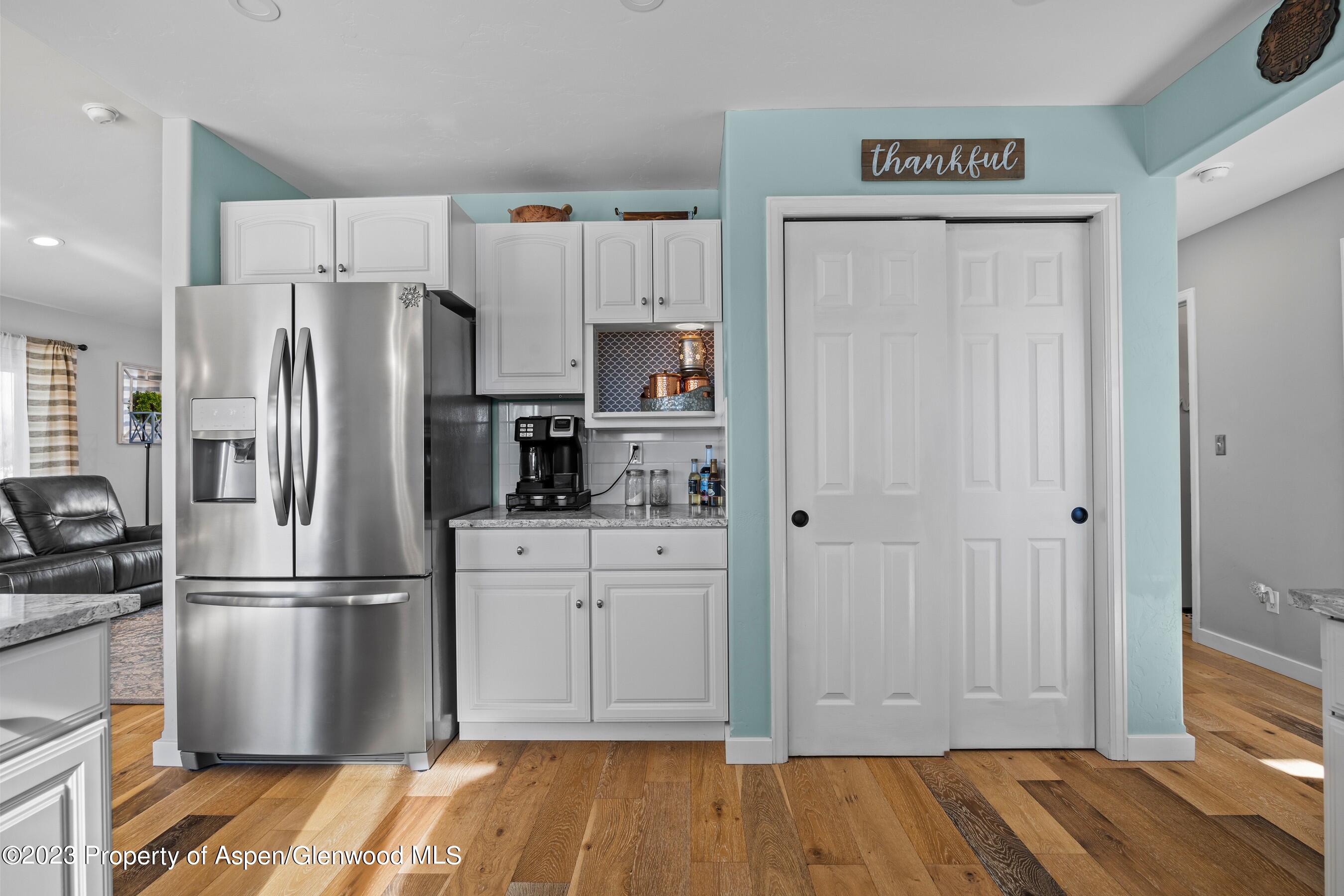 1273 East 18th Way Rifle, CO 81650 - Photo 10 of 26 a kitchen with stainless steel appliances a refrigerator and cabinets