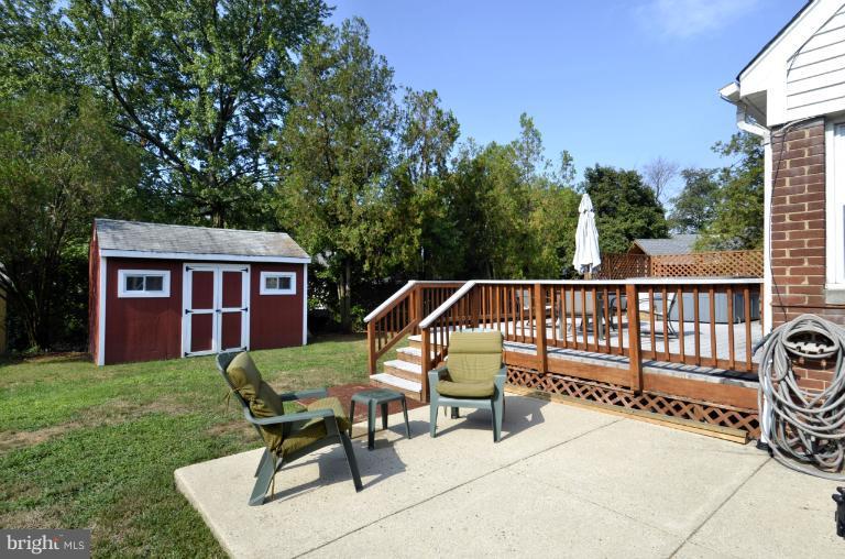 6911 Gilbert Street Springfield, VA 22150 - Photo 9 of 30 a view of a chairs and table in the patio