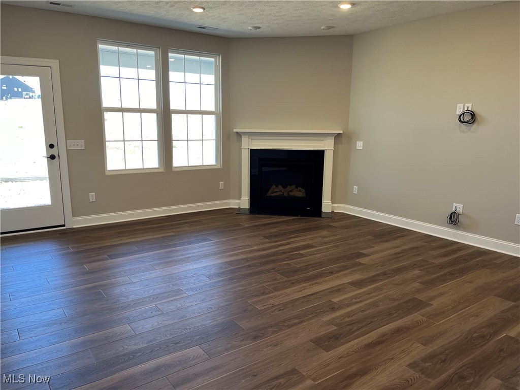 173 Seamore Road Aurora, OH 44202 - Photo 11 of 13 Main living area with gas fireplace and access to rear yard