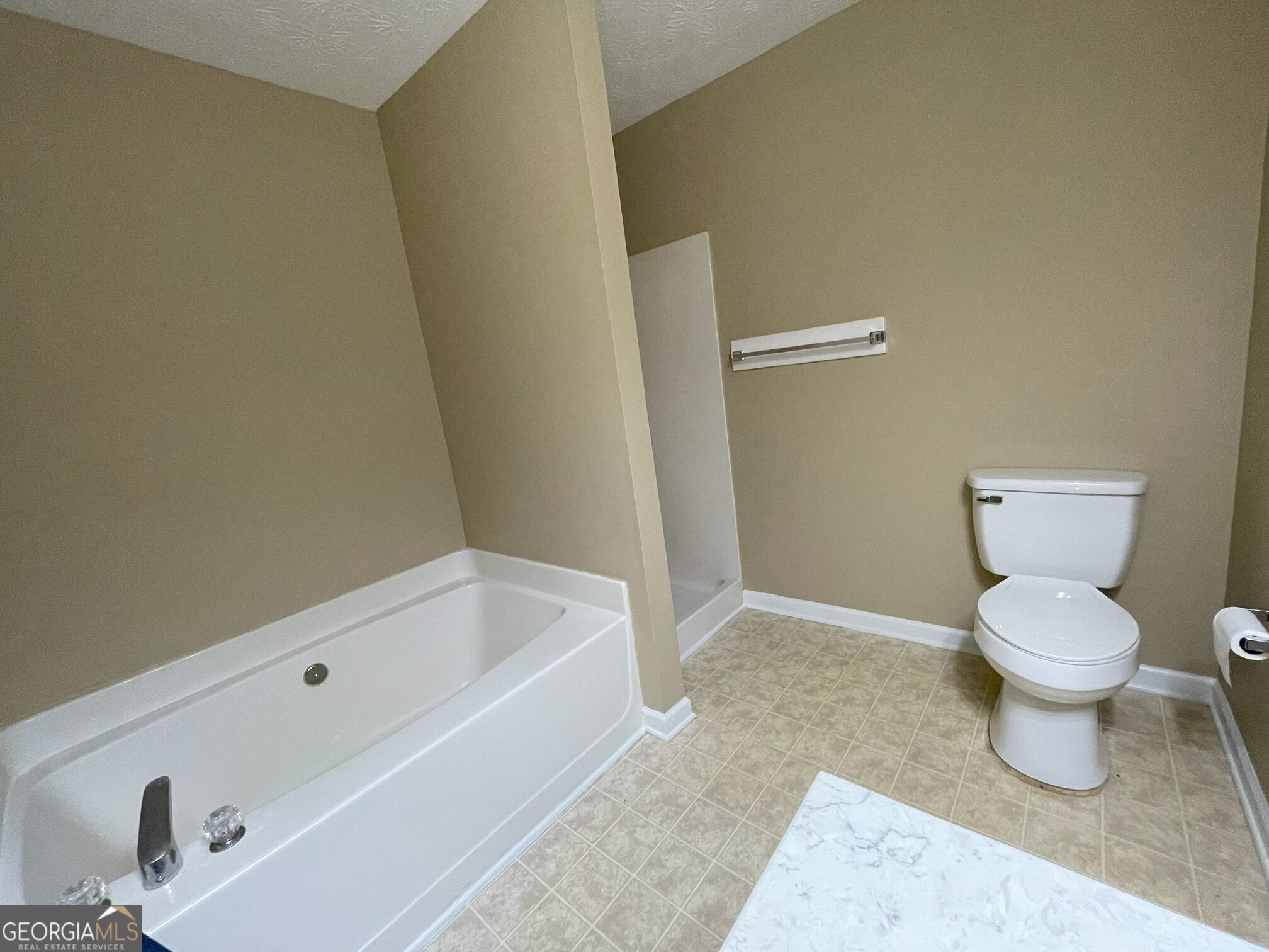 134 Cemetary Road Luthersville, GA 30251 - Photo 13 of 18 a bathroom with a toilet and bathtub