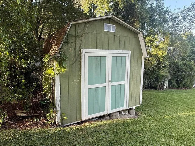 a house with trees in the background