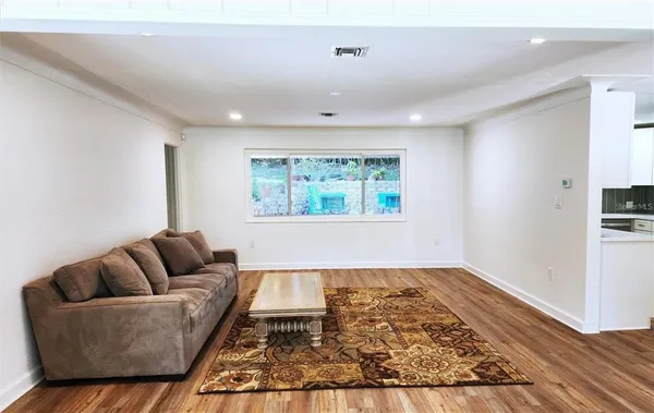 a living room with furniture and a rug