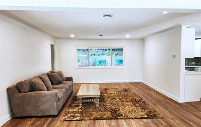 a living room with furniture and a rug
