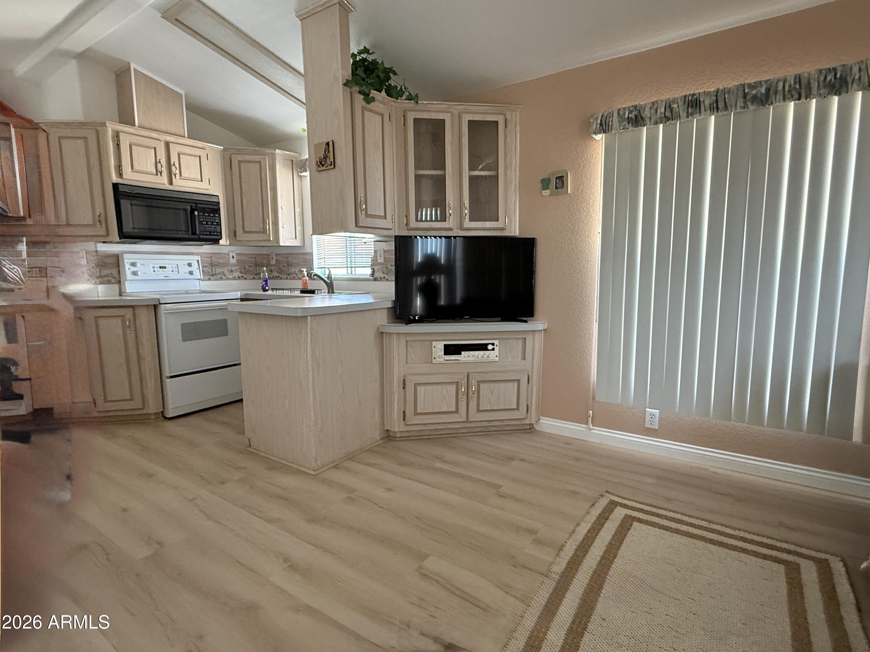21340 Trading Post Trail Congress, AZ 85332 - Photo 4 of 31 a kitchen with a cabinets appliances and a window