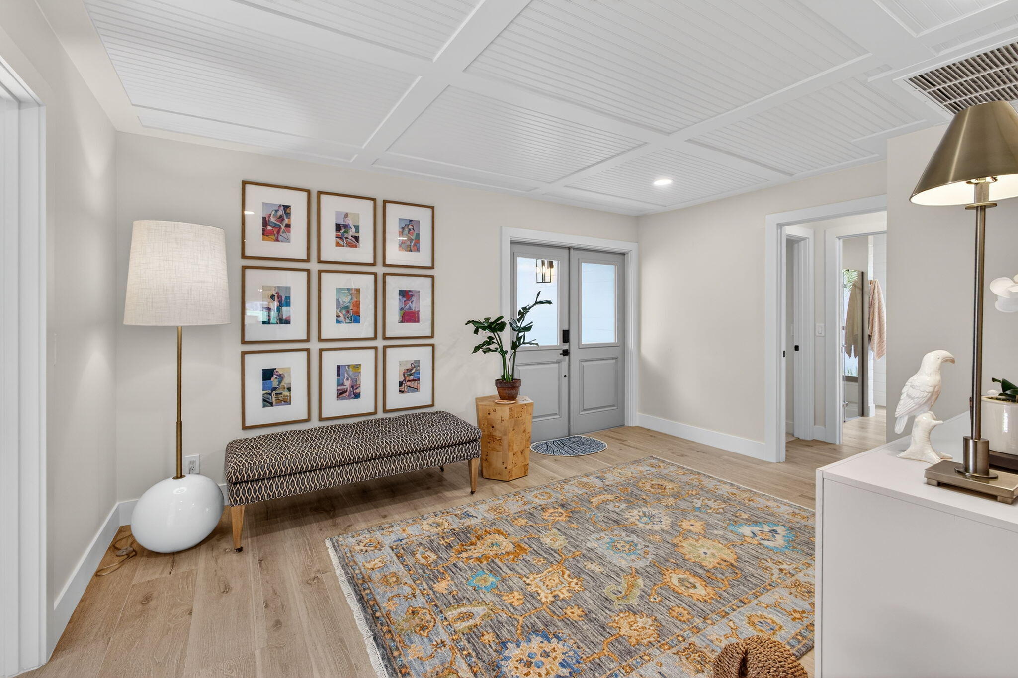 17085 Bay Street Jupiter, FL 33477 - Photo 13 of 44 a living room with furniture and a wooden floor