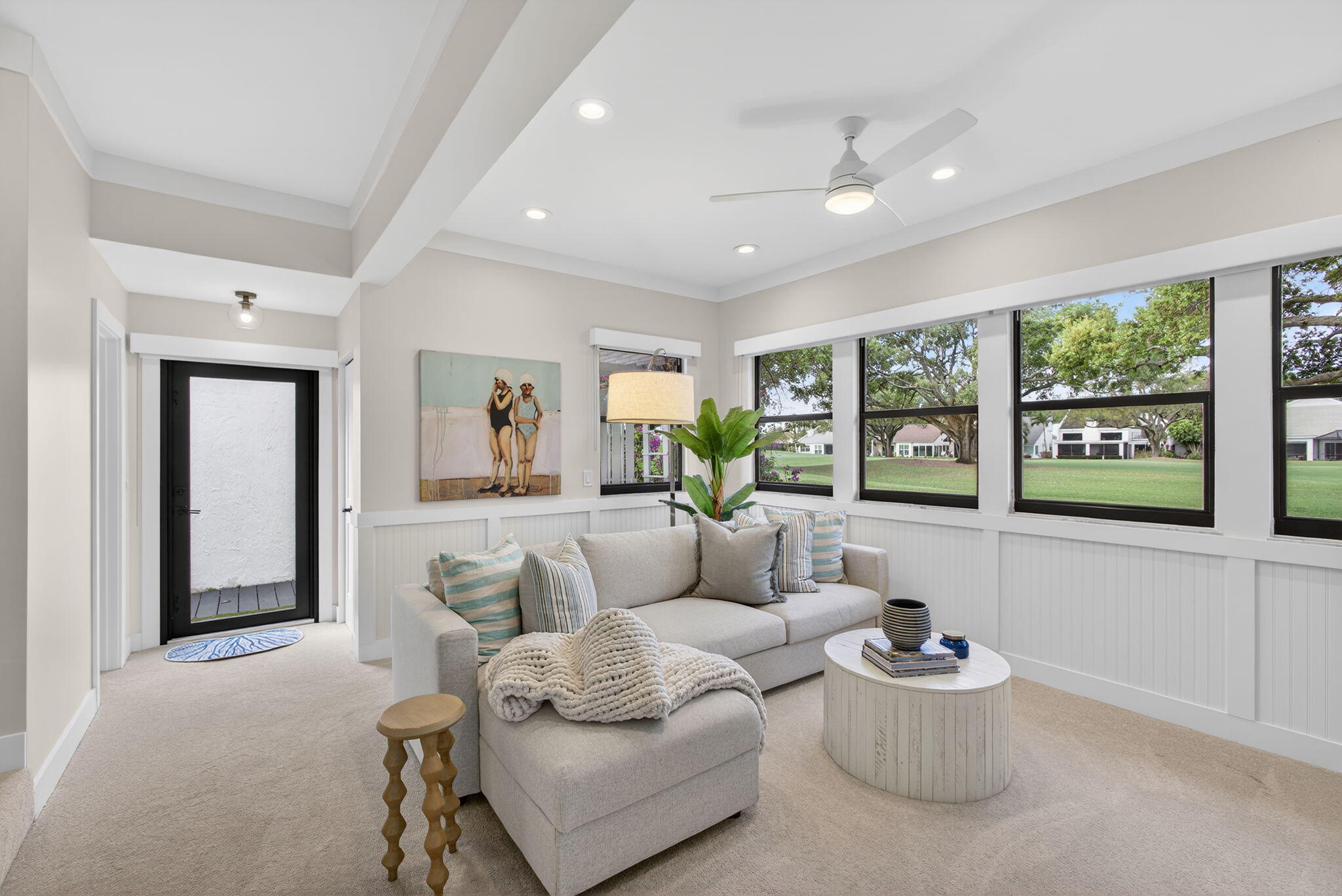 17085 Bay Street Jupiter, FL 33477 - Photo 15 of 44 a living room with furniture and a large window