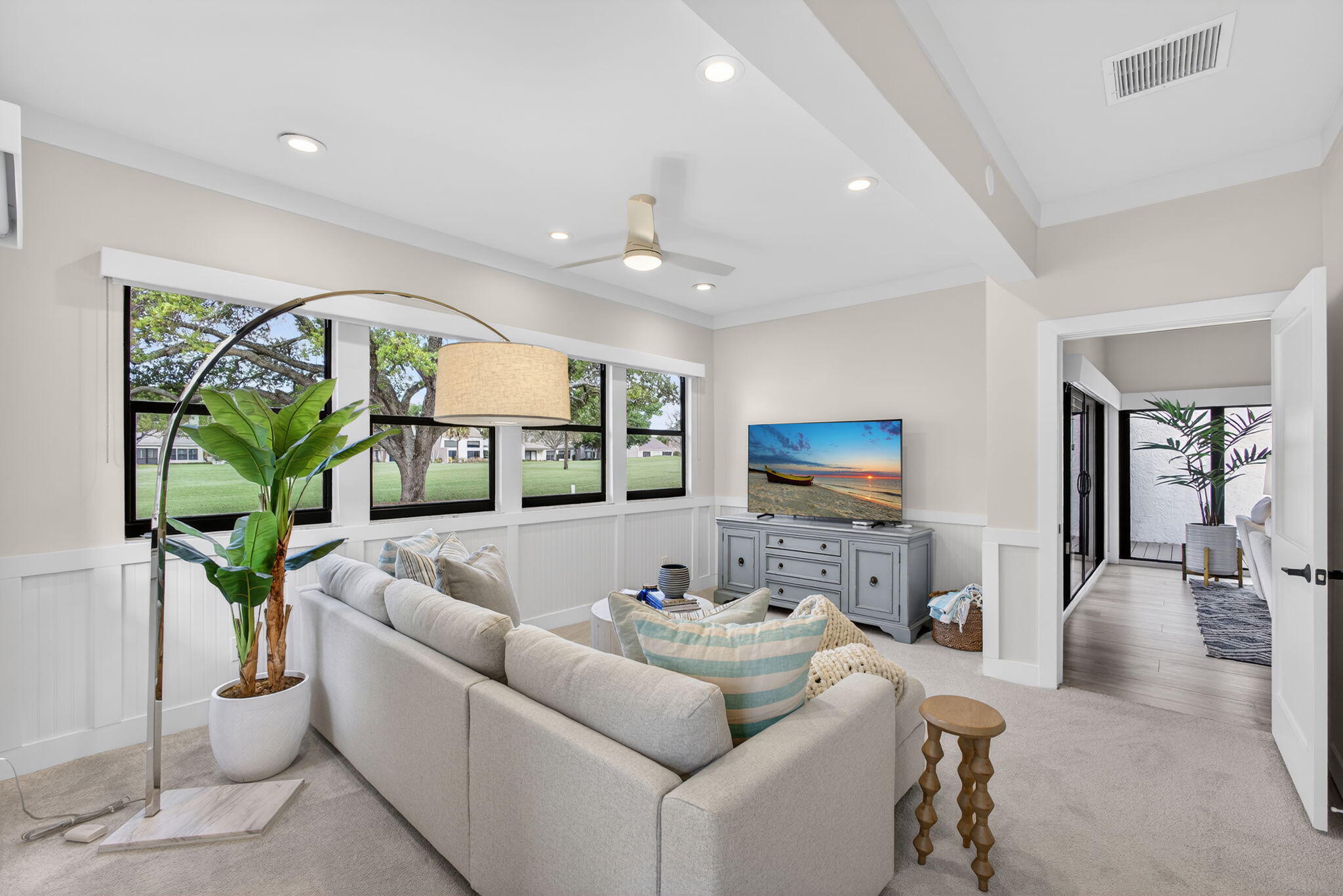 17085 Bay Street Jupiter, FL 33477 - Photo 16 of 44 a living room with furniture and a flat screen tv