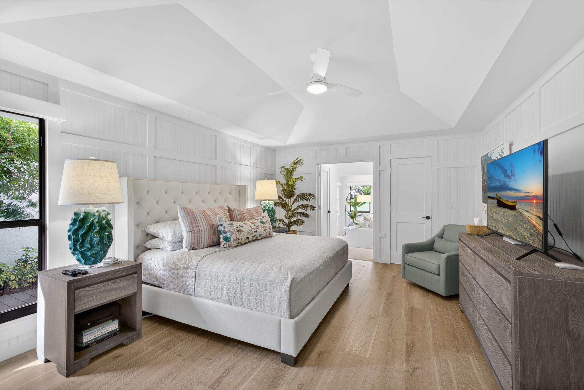 17085 Bay Street Jupiter, FL 33477 - Photo 18 of 44 a bedroom with a bed and large windows