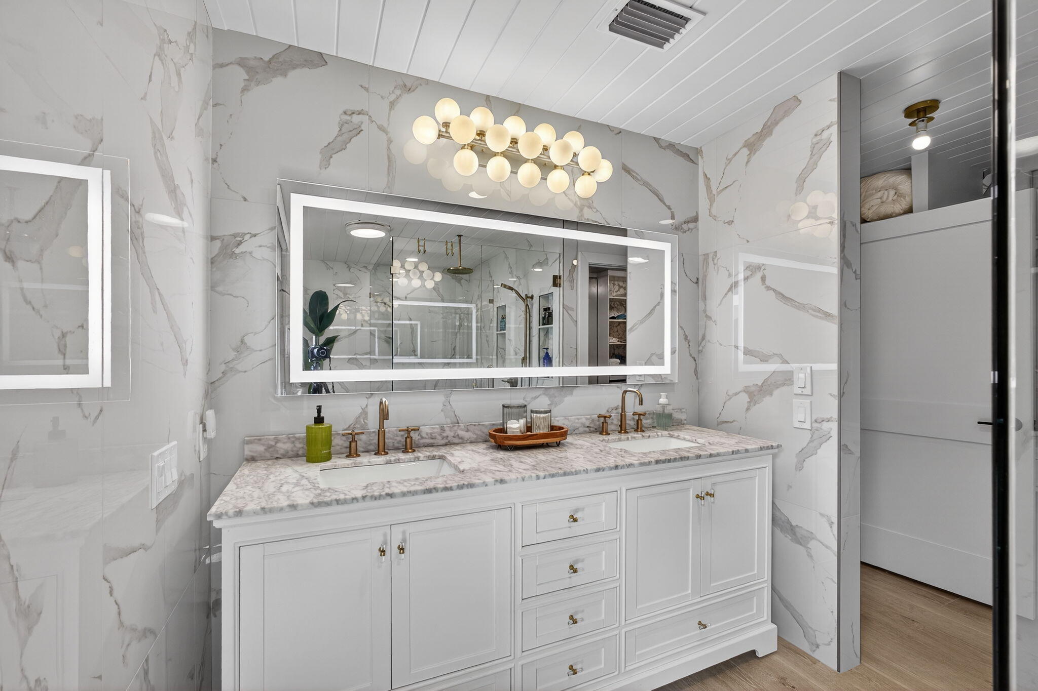 17085 Bay Street Jupiter, FL 33477 - Photo 20 of 44 a bathroom with a granite countertop sink mirror and window