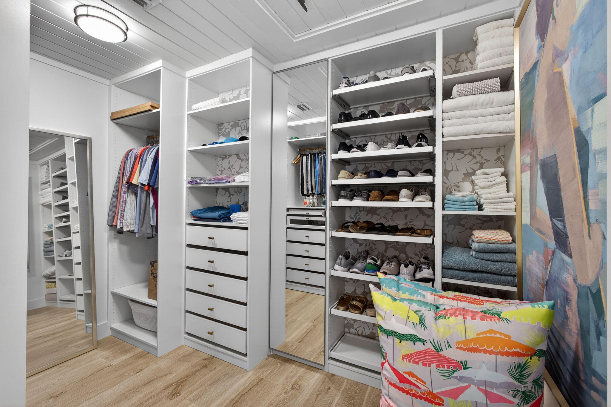 17085 Bay Street Jupiter, FL 33477 - Photo 22 of 44 a view of walk in closet with clothes and shoes
