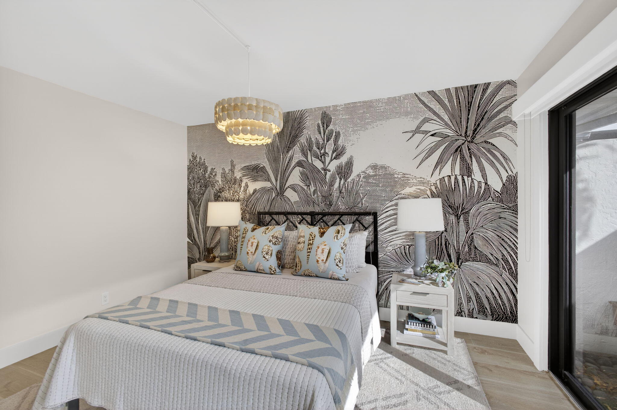 17085 Bay Street Jupiter, FL 33477 - Photo 28 of 44 a bedroom with a bed and flowerpot