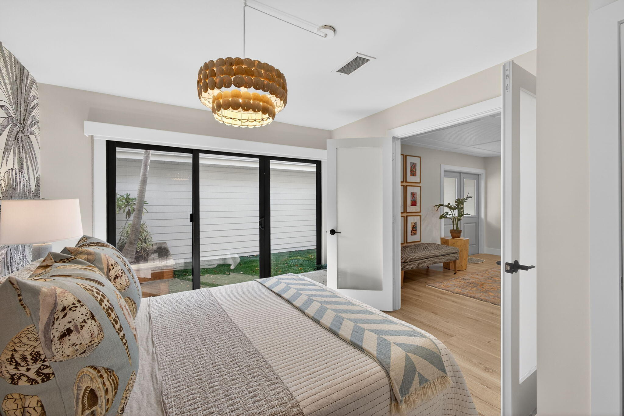 17085 Bay Street Jupiter, FL 33477 - Photo 29 of 44 a bedroom with a bed and a window