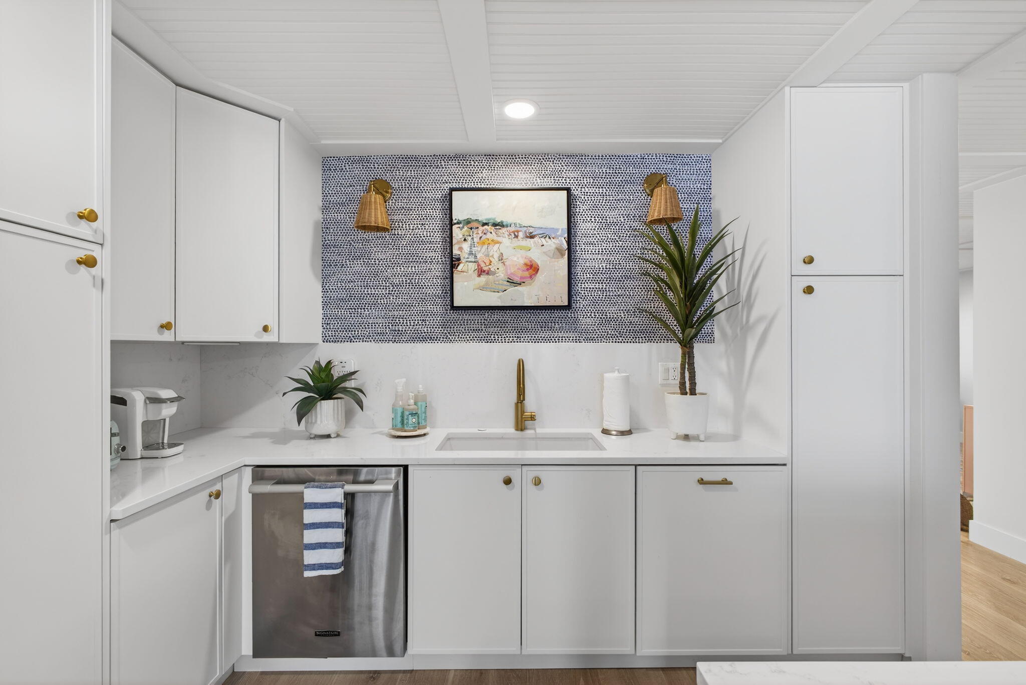 17085 Bay Street Jupiter, FL 33477 - Photo 9 of 44 a kitchen with white cabinets and a sink