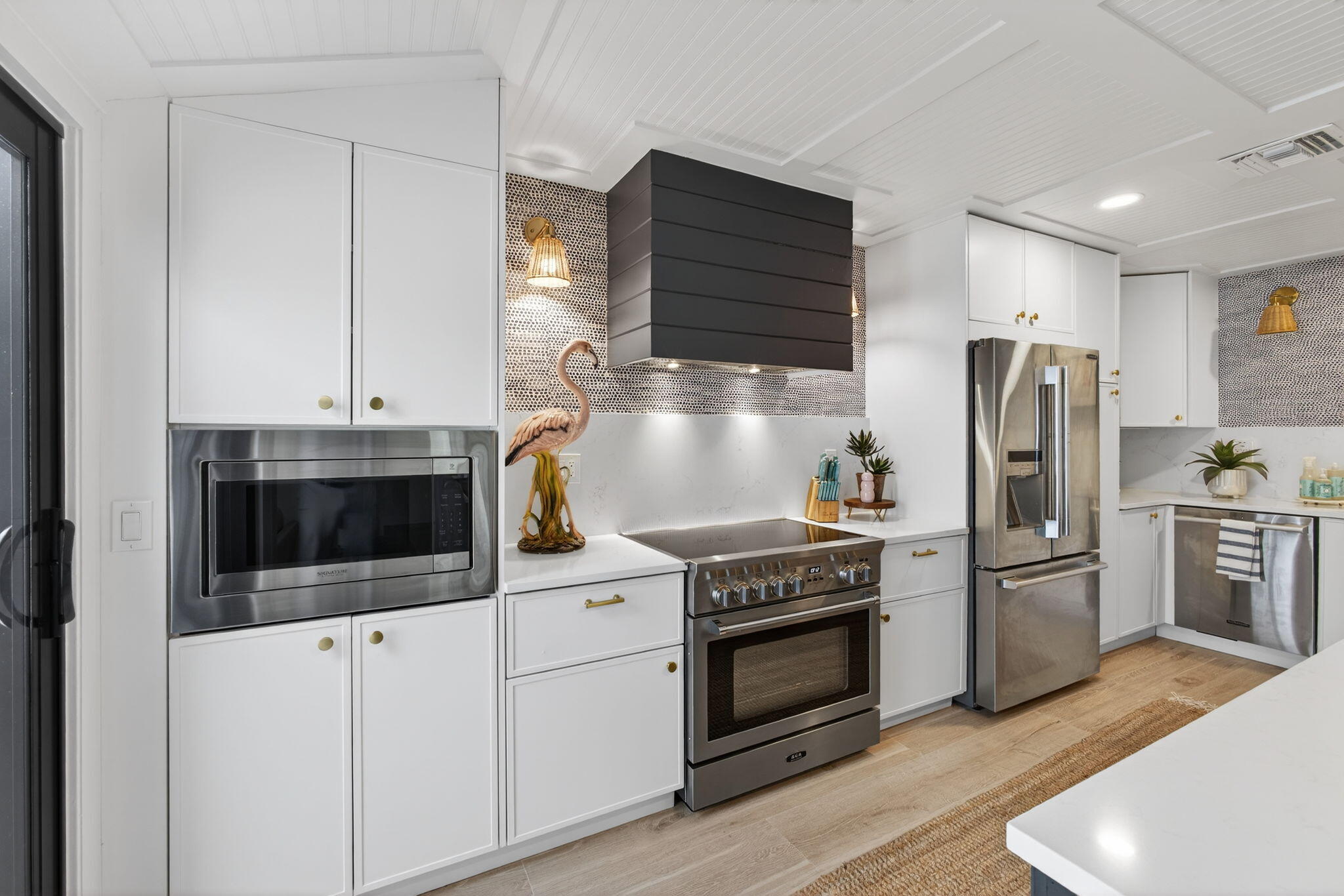 17085 Bay Street Jupiter, FL 33477 - Photo 10 of 44 a kitchen with a stove and a microwave