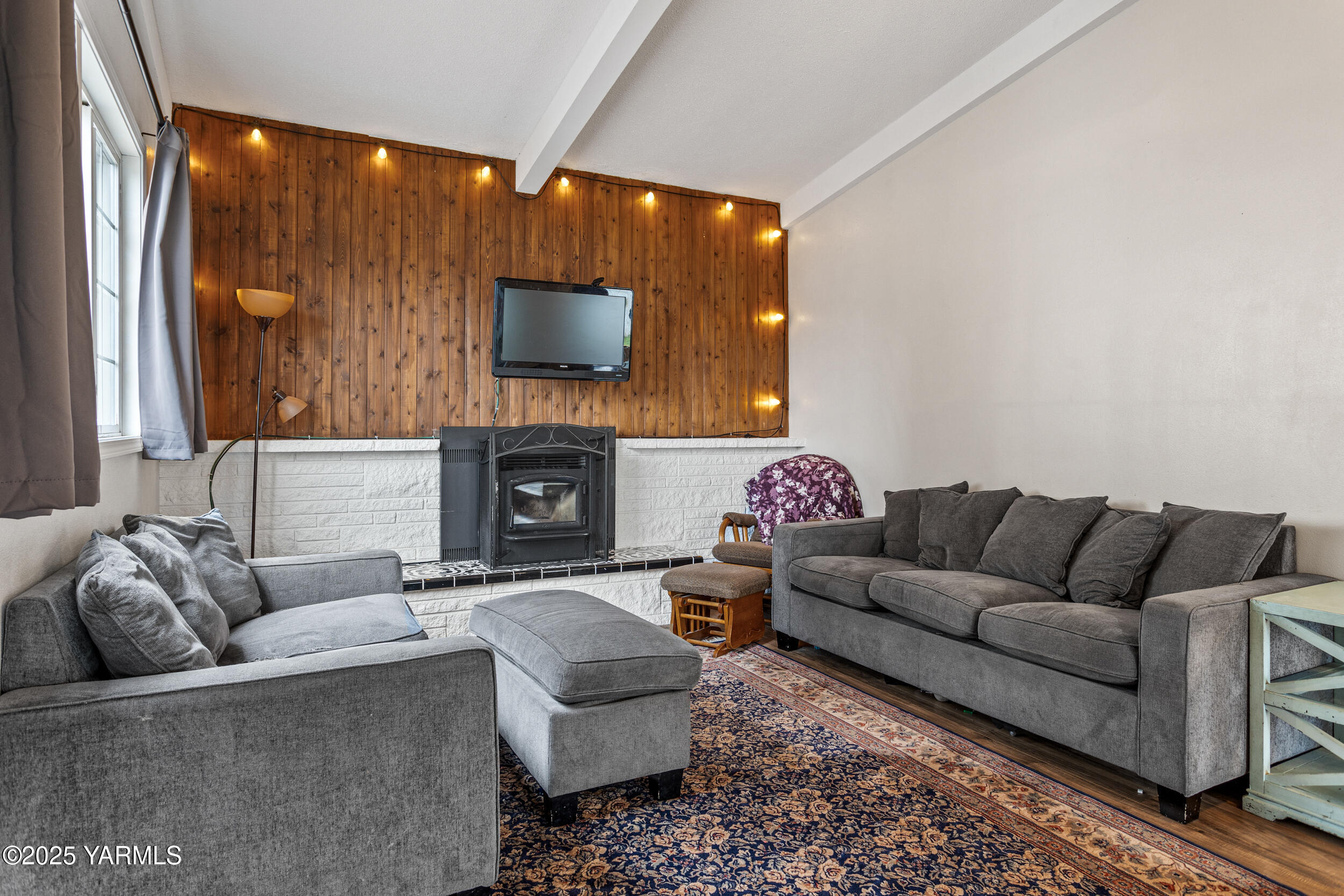 31 Link Road Naches, WA 98937 - Photo 6 of 35 a living room with furniture a flat screen tv and a fireplace