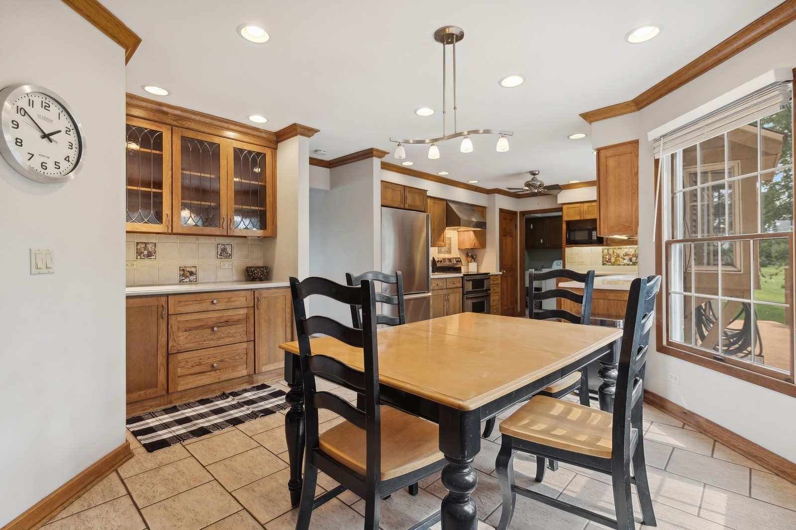 1531 Pinehurst Drive Darien, IL 60561 - Photo 13 of 38 a view of a dining room with furniture and a large window