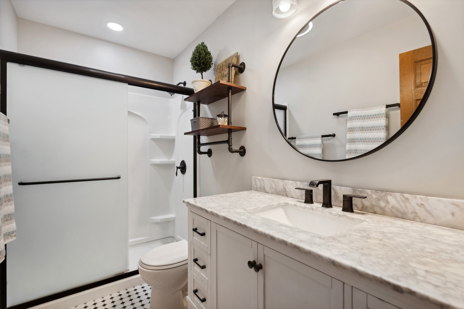 1531 Pinehurst Drive Darien, IL 60561 - Photo 18 of 38 a bathroom with a sink a toilet and a mirror