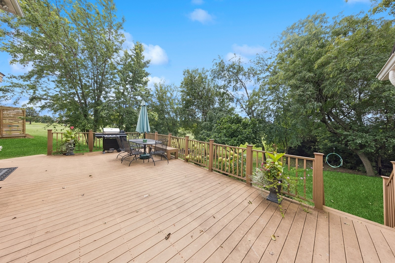 1531 Pinehurst Drive Darien, IL 60561 - Photo 32 of 38 a view of a deck with chairs a barbeque with wooden floor and fence