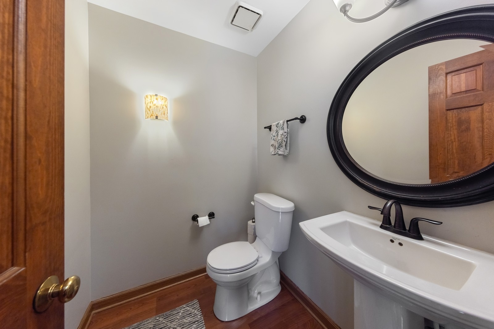 1531 Pinehurst Drive Darien, IL 60561 - Photo 8 of 38 a bathroom with a sink mirror and toilet