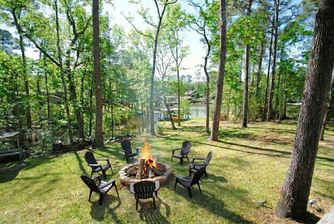 59 Paradise Loop Point Blank, TX 77364 - Photo 26 of 41 Plenty of outdoor space to enjoy, including a fire pit.
