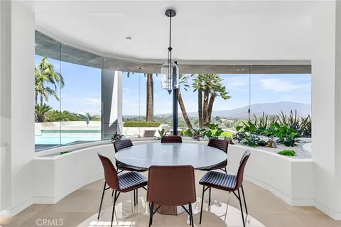 a kitchen with kitchen island granite countertop sink and window