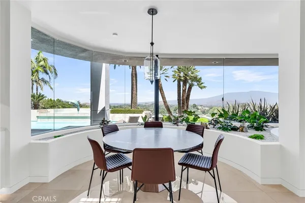 a kitchen with kitchen island granite countertop sink and window