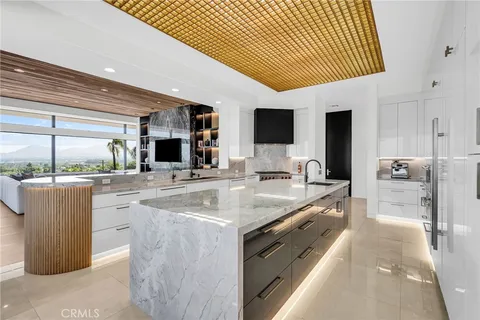 a spacious bathroom with a granite countertop sink and mirror