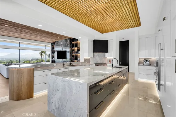 a spacious bathroom with a granite countertop sink and mirror