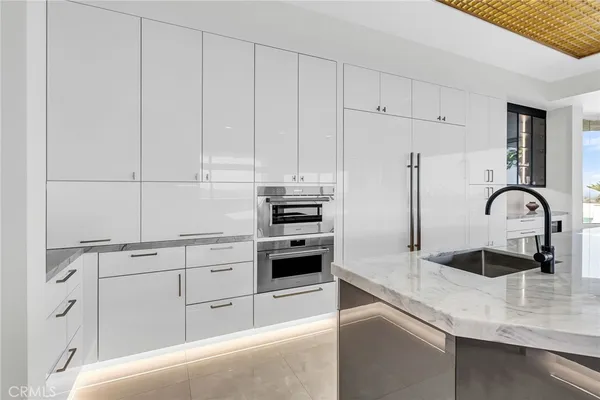 a bathroom with a bathtub a sink a mirror and a shower