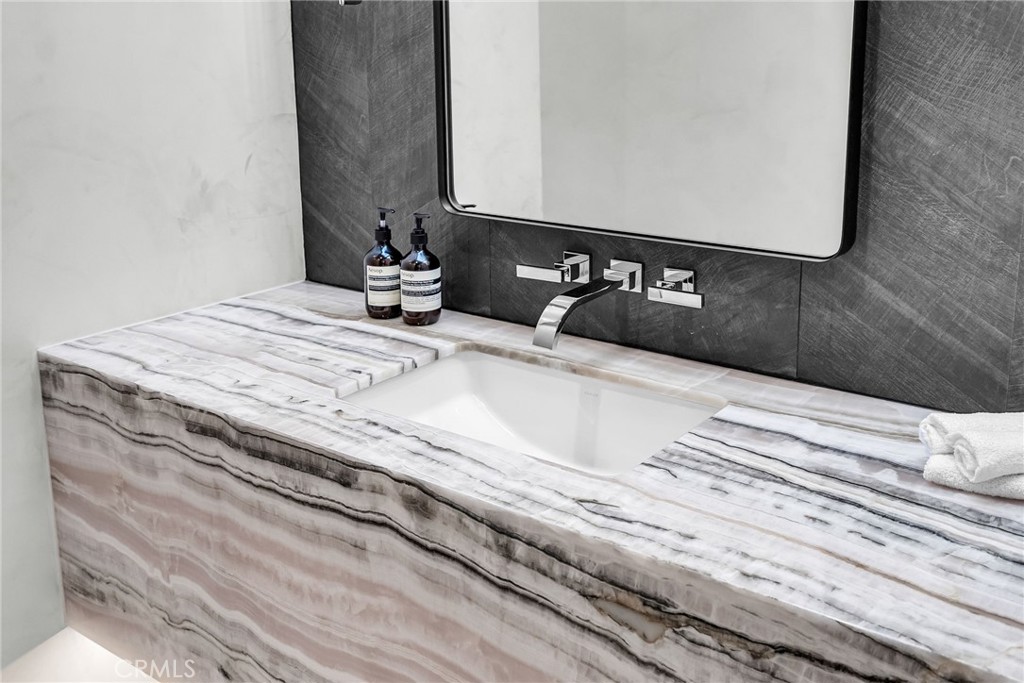 2130 Old Quarry Road Riverside, CA 92506 - Photo 39 of 75 a bathroom with a sink and a mirror