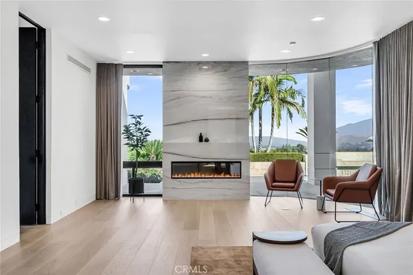 a bedroom with a bed and large window