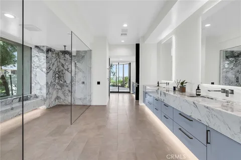 a utility room with sink dryer and washer