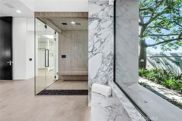 a palm tree sitting in a yard next to a yard