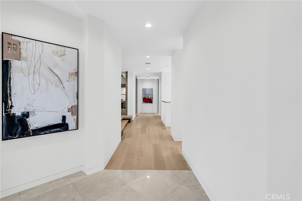 2130 Old Quarry Road Riverside, CA 92506 - Photo 57 of 75 a hallway with wooden floor and a bathroom