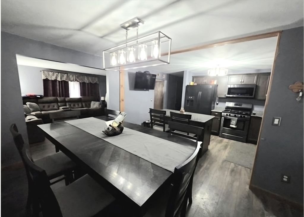 43 Emily Jeffers Road, Unit 43 Randolph, MA 02368 - Photo 13 of 31 a kitchen with a dining table and chairs