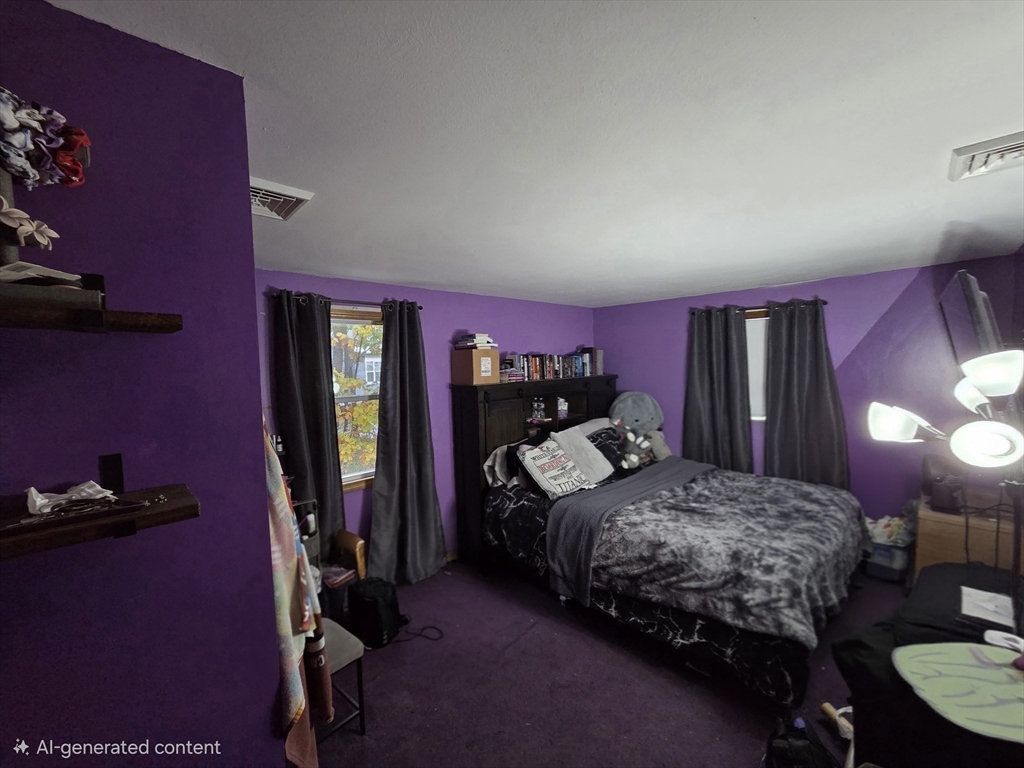 43 Emily Jeffers Road, Unit 43 Randolph, MA 02368 - Photo 21 of 31 a bedroom with a bed and a lamp